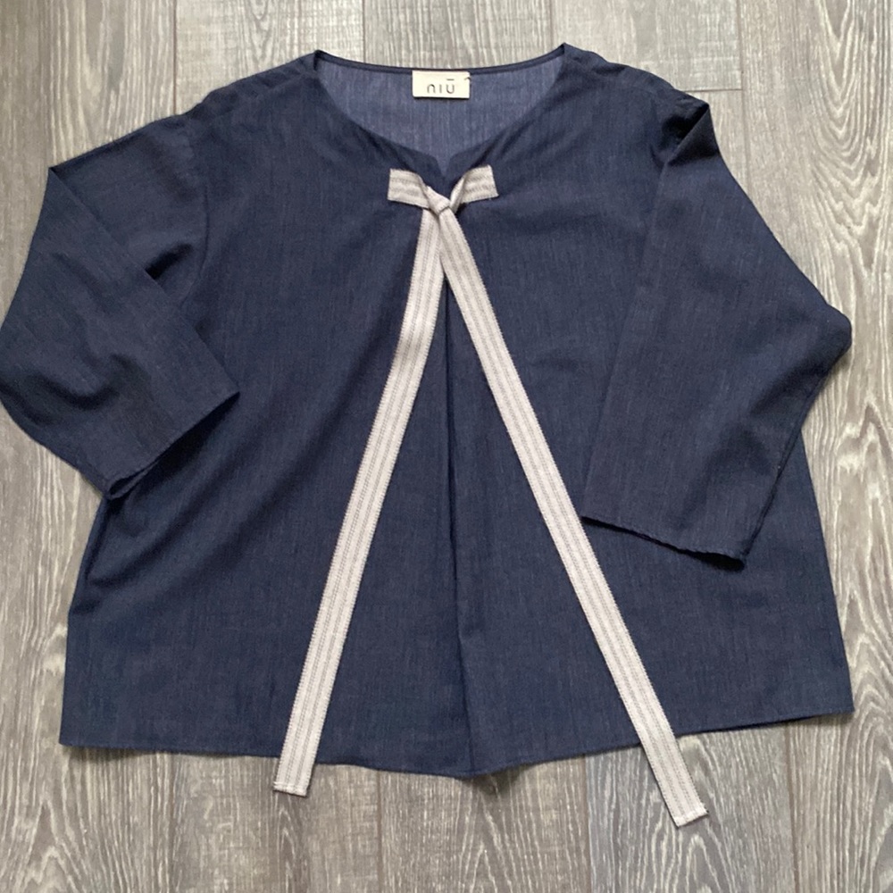 NIU Swing Top